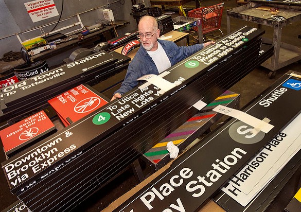 4 and 5 signs and S shuttle are stacked during work at New York City Transit's Sign Shop