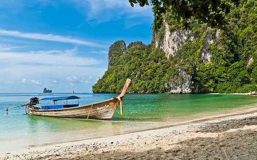 Photo of a longtail at a beach in Krabi, Thailand