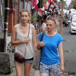 Monkey Forest Road Tourists on Monkey Forest Road in central Ubud in Bali, Indonesia