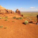 Verso Teardrop Arch Walking on the Top of Rock Door Mesa near Monument Valley