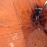 Entriamo dentro Spooky Entering from above in Spooky Slot Canyon in Grand Staircase Escalante National Monument in Utah USA