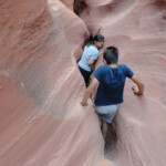 Il canyon ci inghiotte Entering the thinnest section of Spooky Gulch in the Dry Fork of Coyote Gulch in Grand Staircase Escalante National Monument in Utah USA