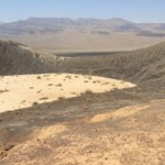 La vista ora spazia lontano One of the many little secondary craters South of main Ubehebe Crater Death Valley National Park California USA