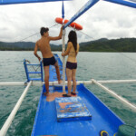 Sulla via del ritorno Boat Approaching the Main Beach of Port Barton, Palawan, Philippines